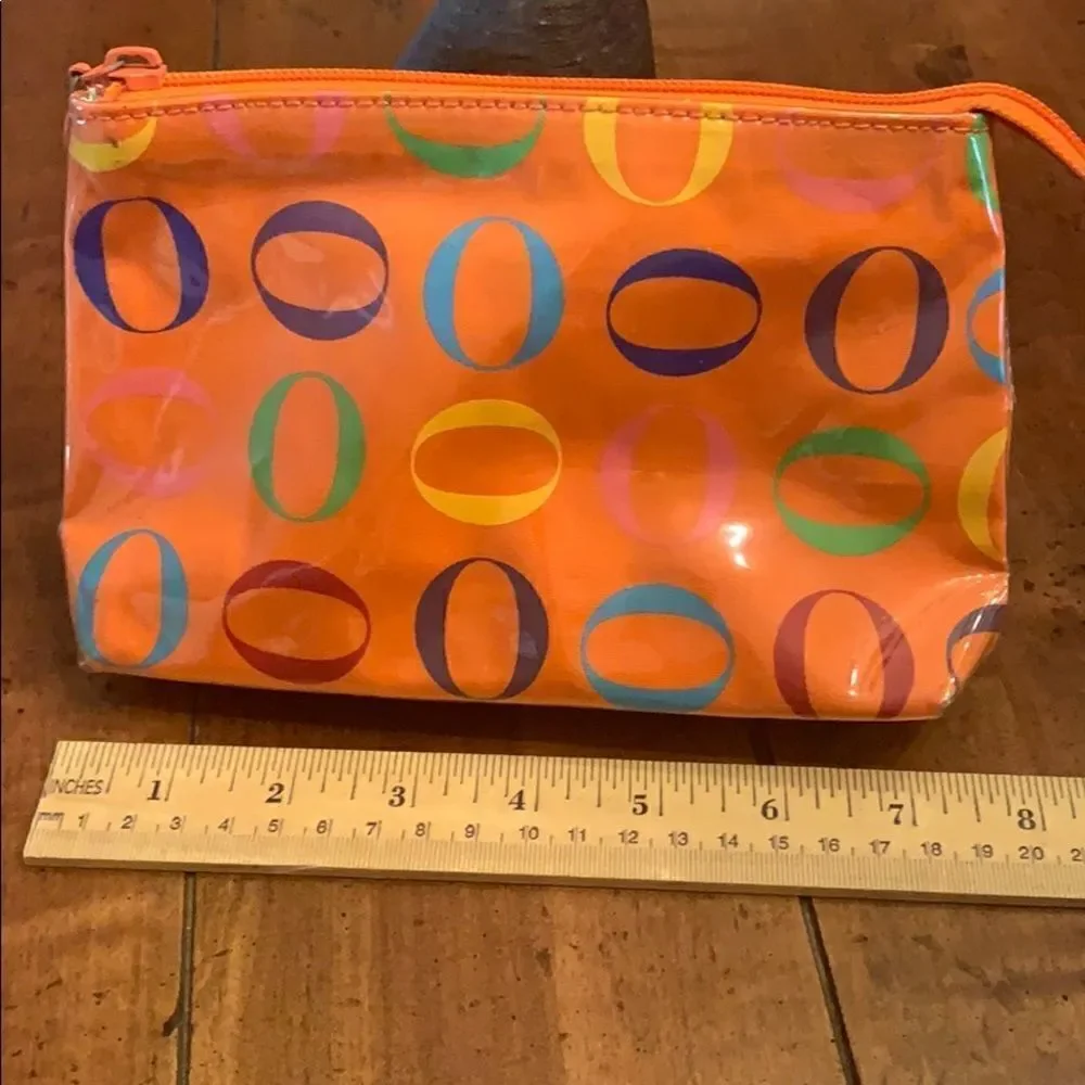 Never used Rare Oprah Orange O Logo Cosmetic bag.